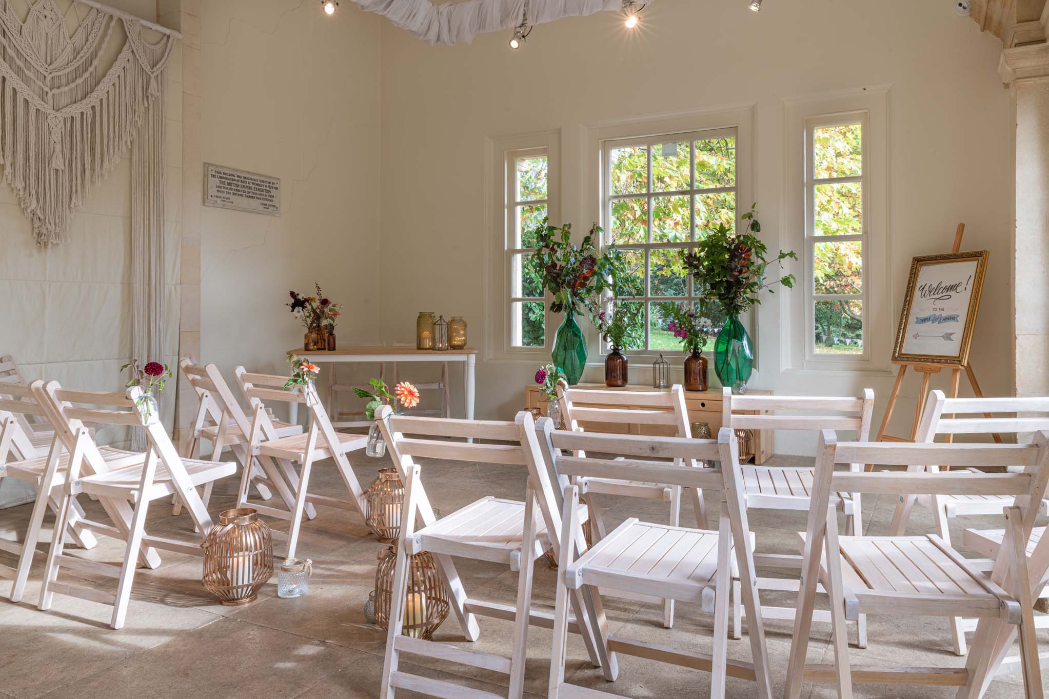 Rows of chairs ready for a wedding ceremony inside the Temple of Minerva